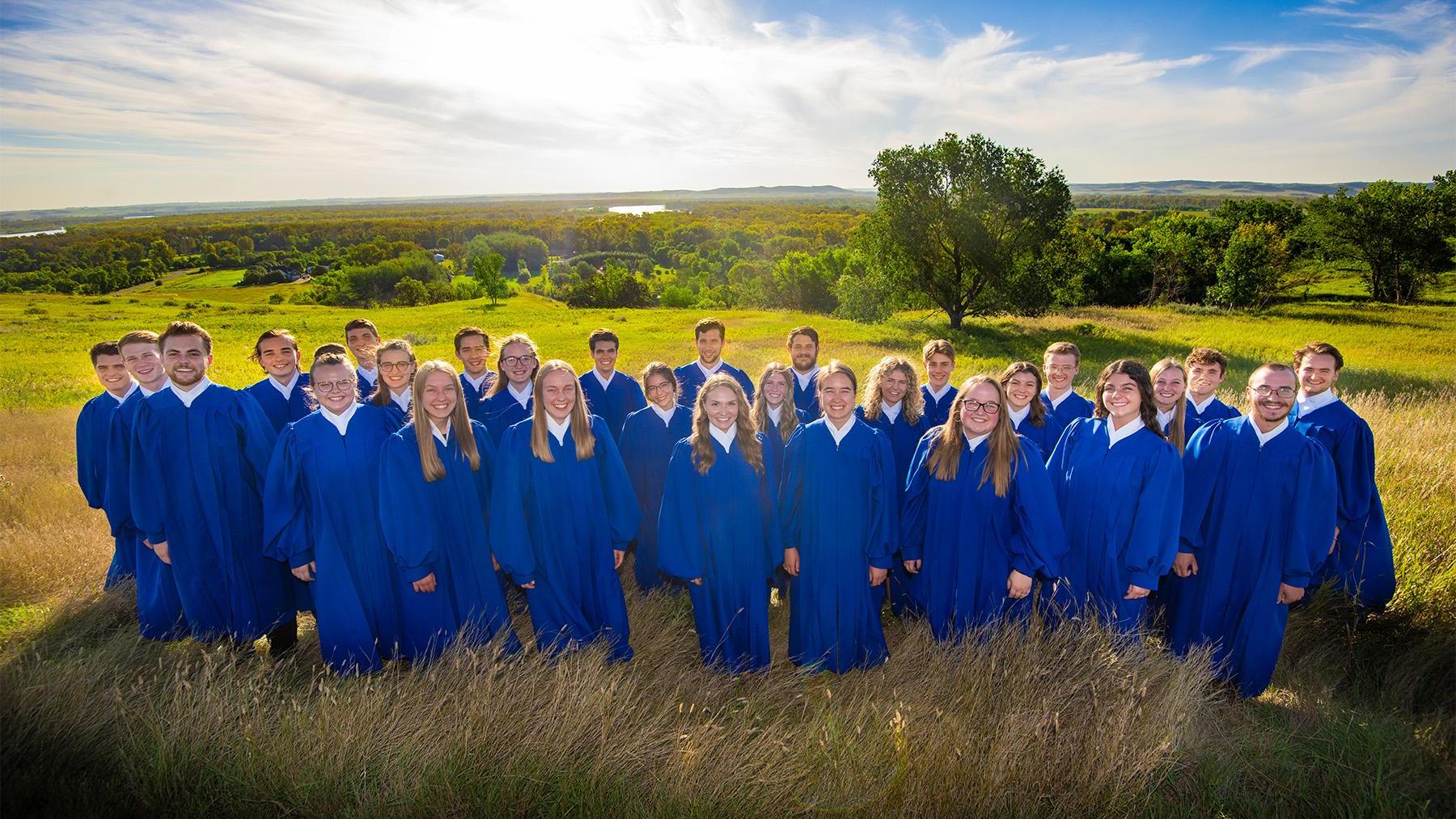 Capella students outdoors in a field